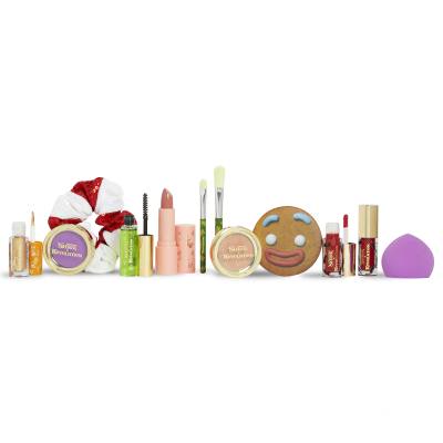 Makeup Revolution London Shrek Gingy 12 Days Advent Calendar Darilni set senčilo za oči 2 kos + osvetljevalec 1 kos + glos za ustnice 2 kos + šminka 1 kos + rdečilo 1 kos + gel za obrvi 1 kos + čopič 2 kos + aplikator za ličenje 1 kos + ogledalo 1 kos + elastika za lase 1 kos